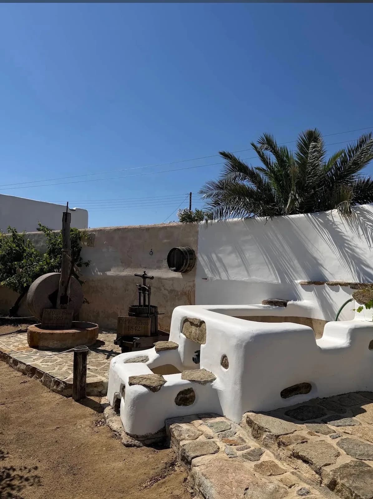 The Old Olive Press of 1825 and the Old Wine Press of 1842 in the museum courtyard